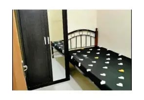 A single room in Al Rigga with wardrobe next to it.