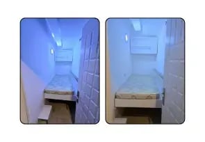 A small single room with white lighting.