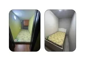 Narrow Single Room in Al Rigga with small wardrobe at the top corner.